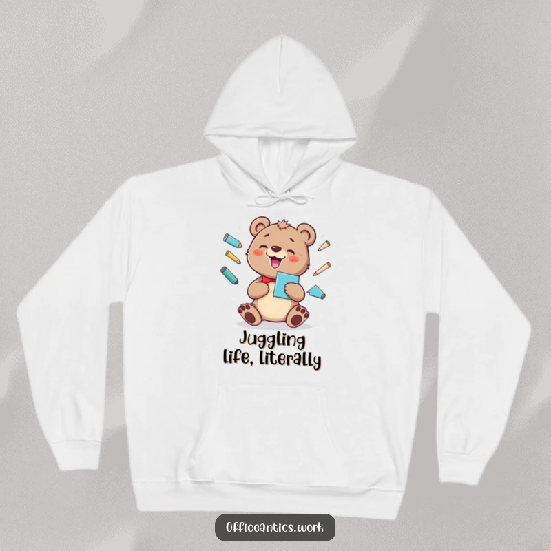 Funny hoodie featuring a cheerful bear cub juggling office supplies with a silly grin, perfect for cozy humor.