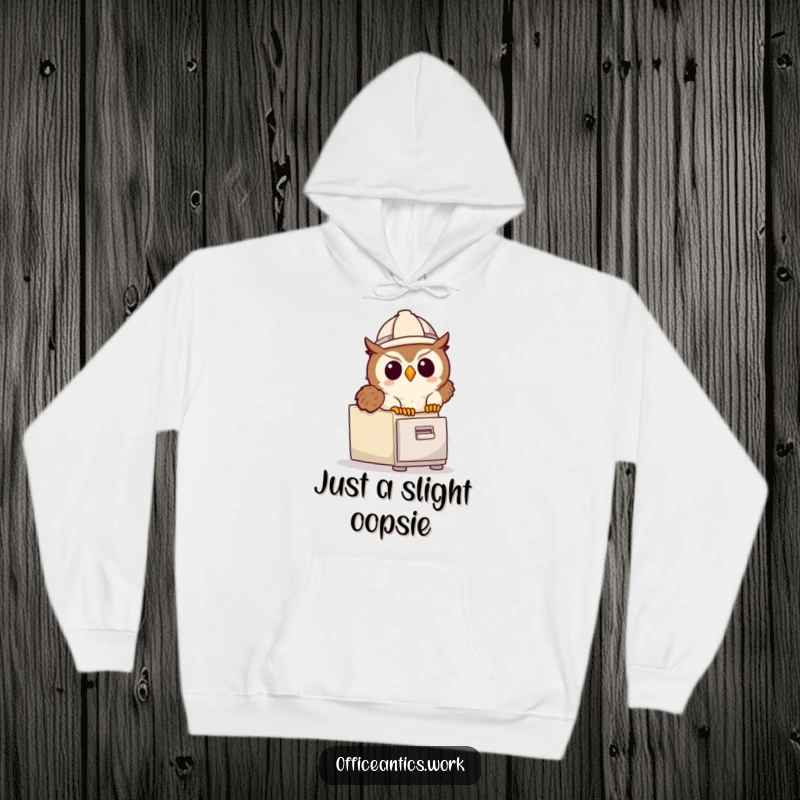 Funny hoodie showing a cute owl wearing a hard hat, tripping over a file cabinet, perfect for cozy and humorous wear.